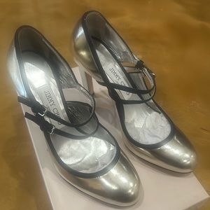 Jimmy Choo stunning silver with black bands, never worn.